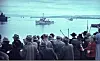 Folkemengde på Rådhusplassen ved Honnørbrygga venter trolig på kronprins Olavs hjemkomst den 13.mai 1945.