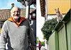 Björn Lindahl og en katt på et gjerde.