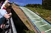 OSLO 20180627.Maren Lundby i svevet i Midtstubakken i Holmenkollen hvor de norske hopperne trener på plast i det fine sommerværet.