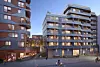 Obos-prosjektet på Vollebekk: Til h. bygget på åtte etasjer, mens høyblokka på 59 meter og 18 etasjer sees til v. Illustrasjon: Oxivisuals / Obos